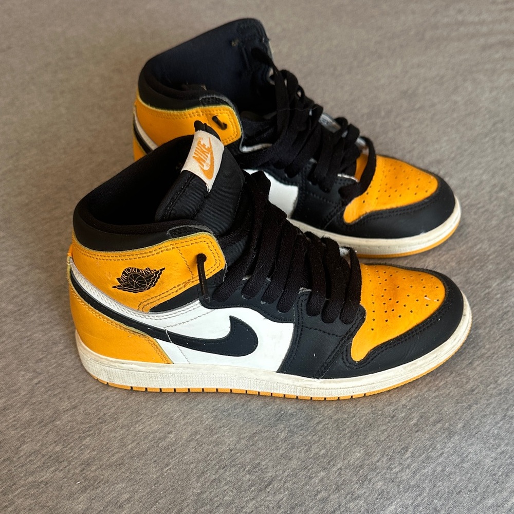 Nike Air Jordan Retro High Tops in Black, White, and Orange
